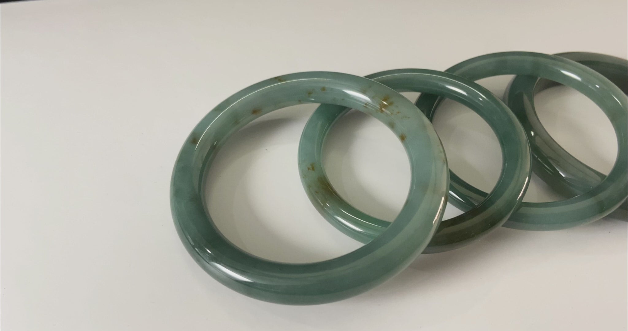 A honey green mist jadeite bangle.