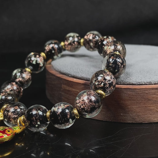 A midnight sparkle incense ash Liuli beaded bracelet.