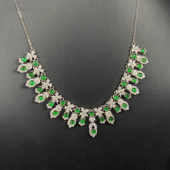 A lush green bloom drape jadeite pendant.