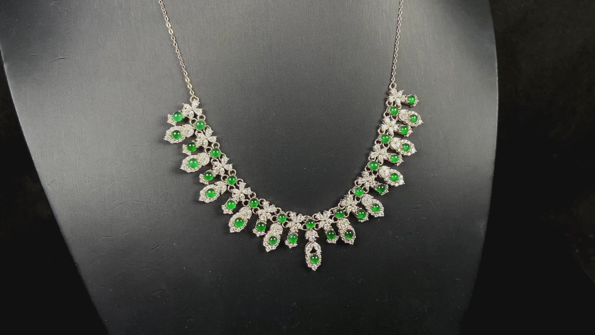 A lush green bloom drape jadeite pendant.