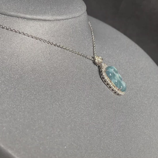 A clear ice blue leaf jadeite pendant.