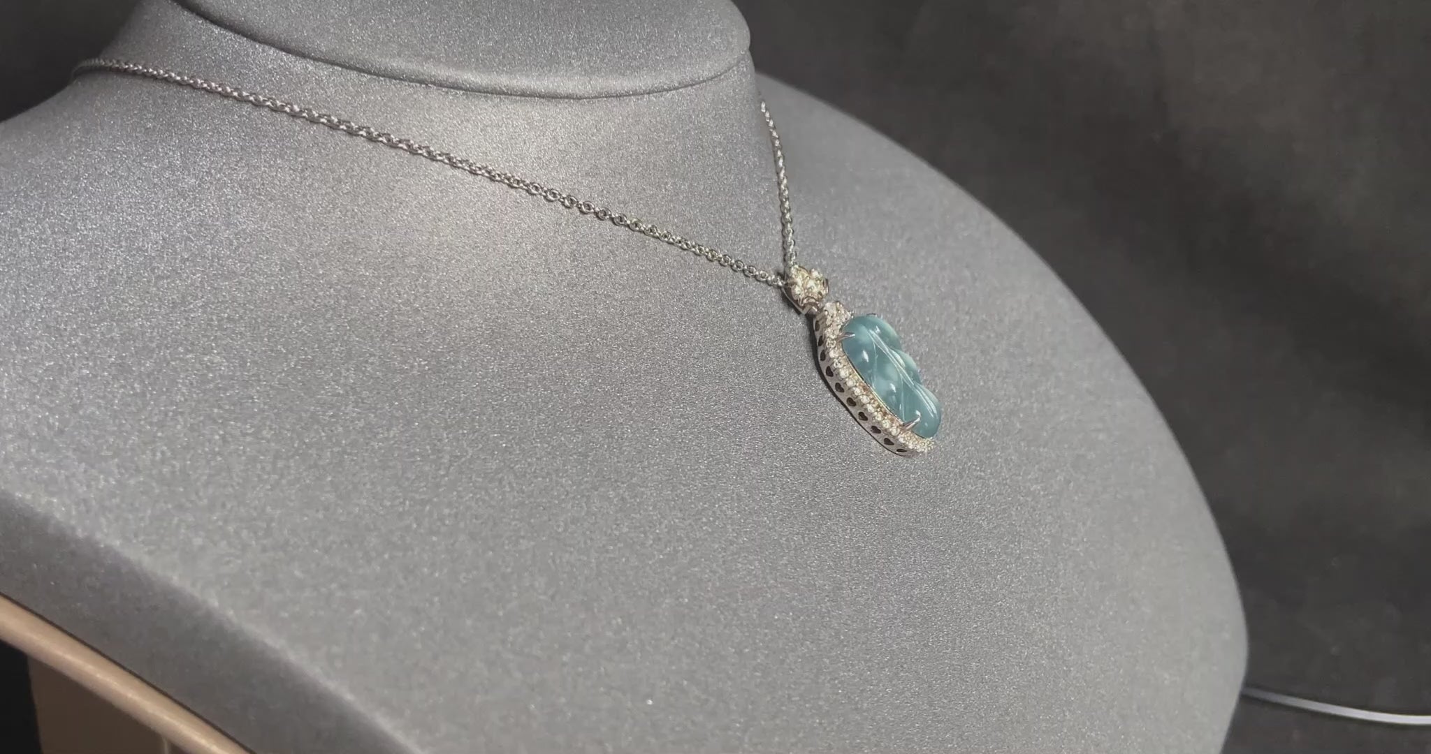 A clear ice blue leaf jadeite pendant.