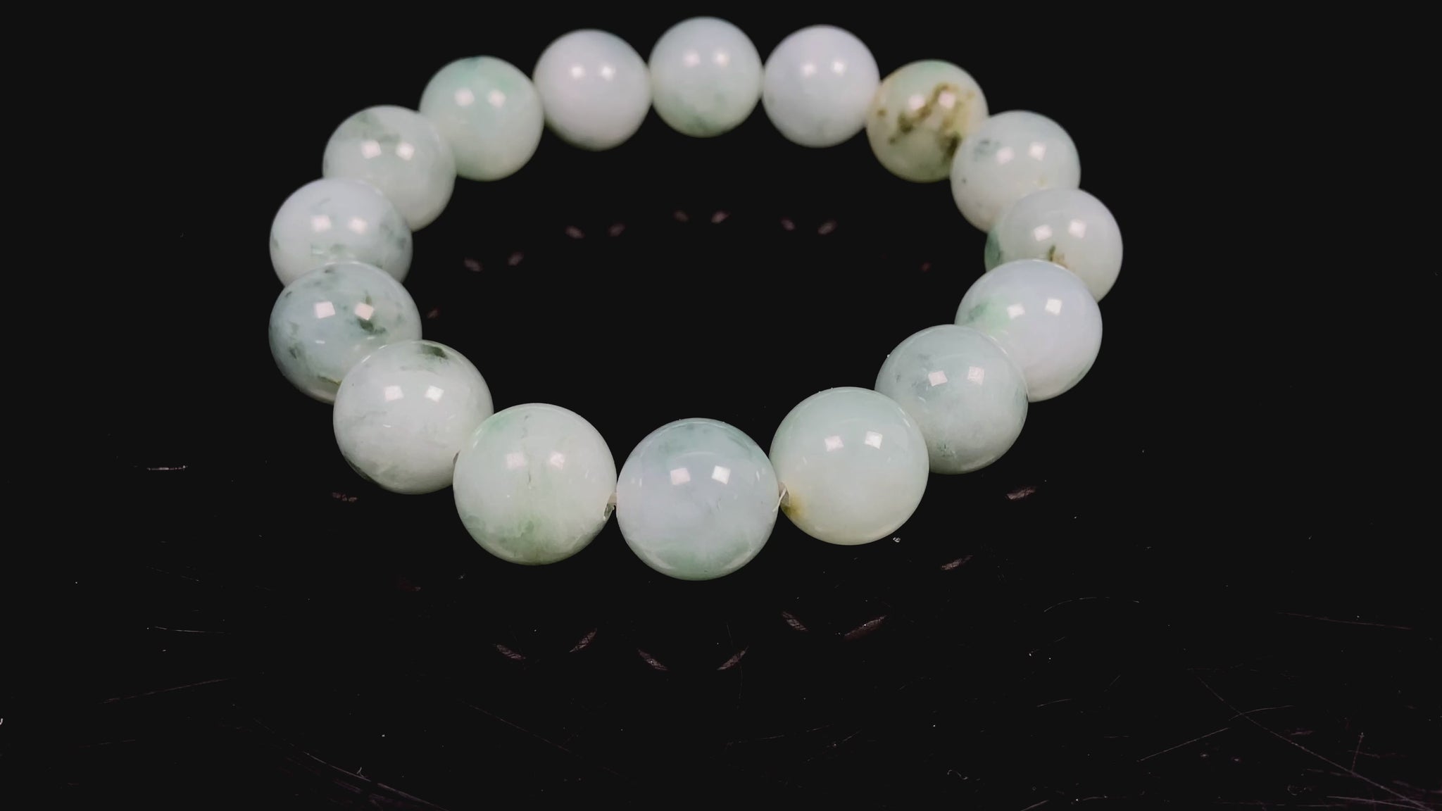 A light green mist beads bracelet.