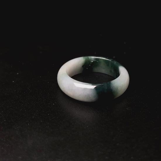 A ink green cloud jadeite ring.