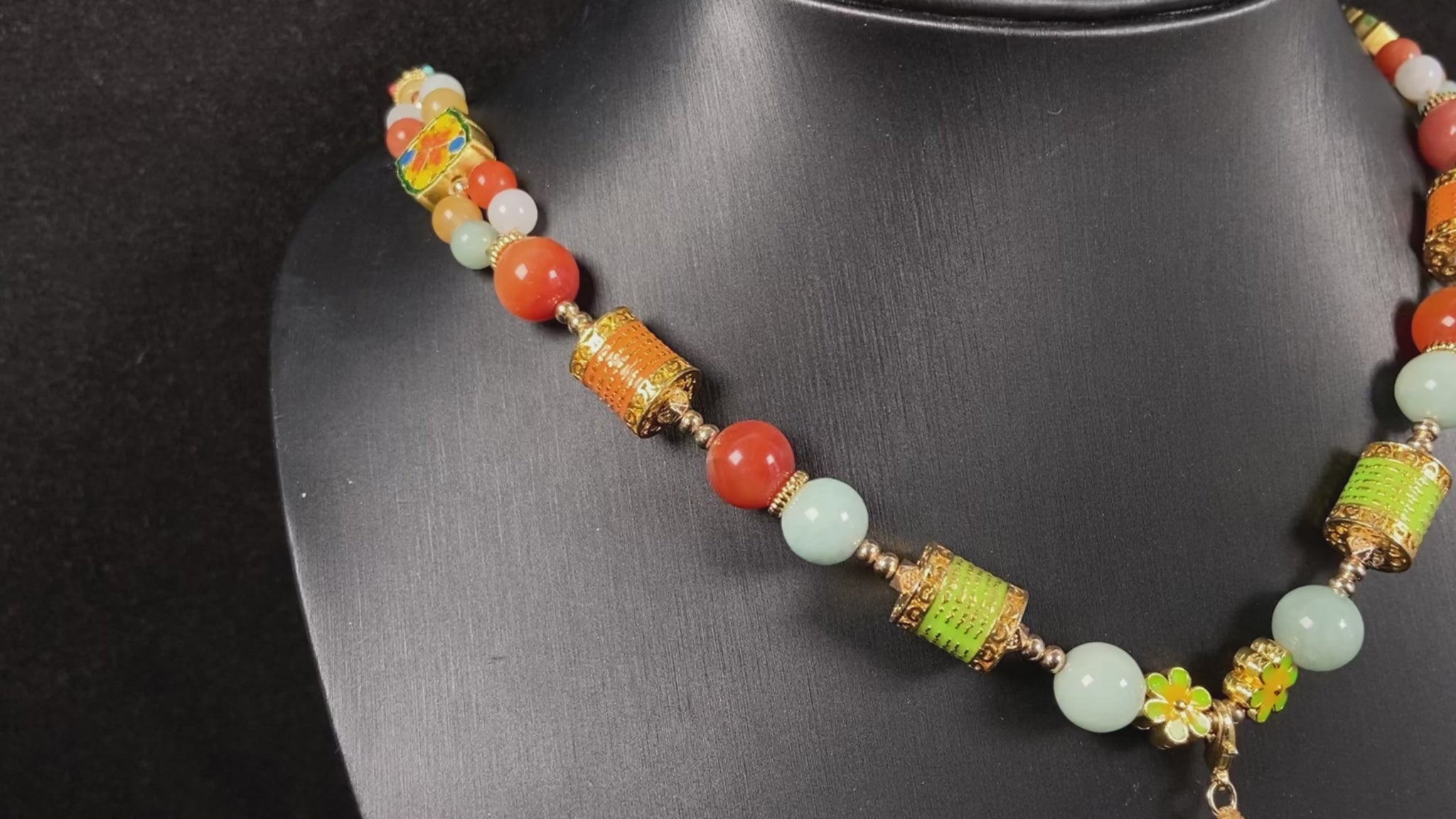 A sleek pale white double ring peace buckle jadeite pendant.