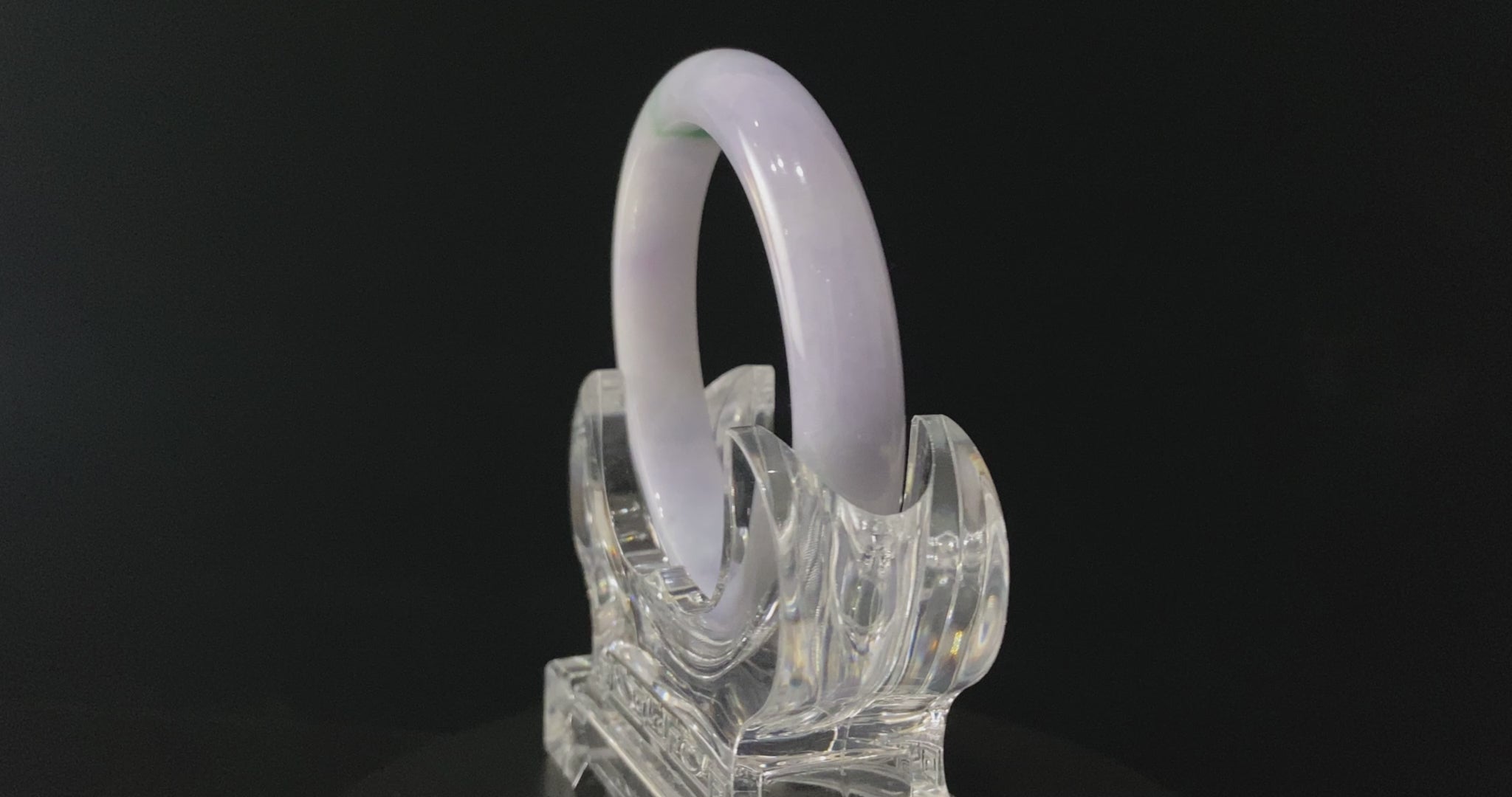 A lavender green streak jadeite bangle.