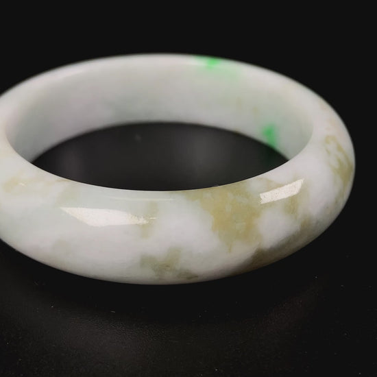 A green sprout jadeite bangle.