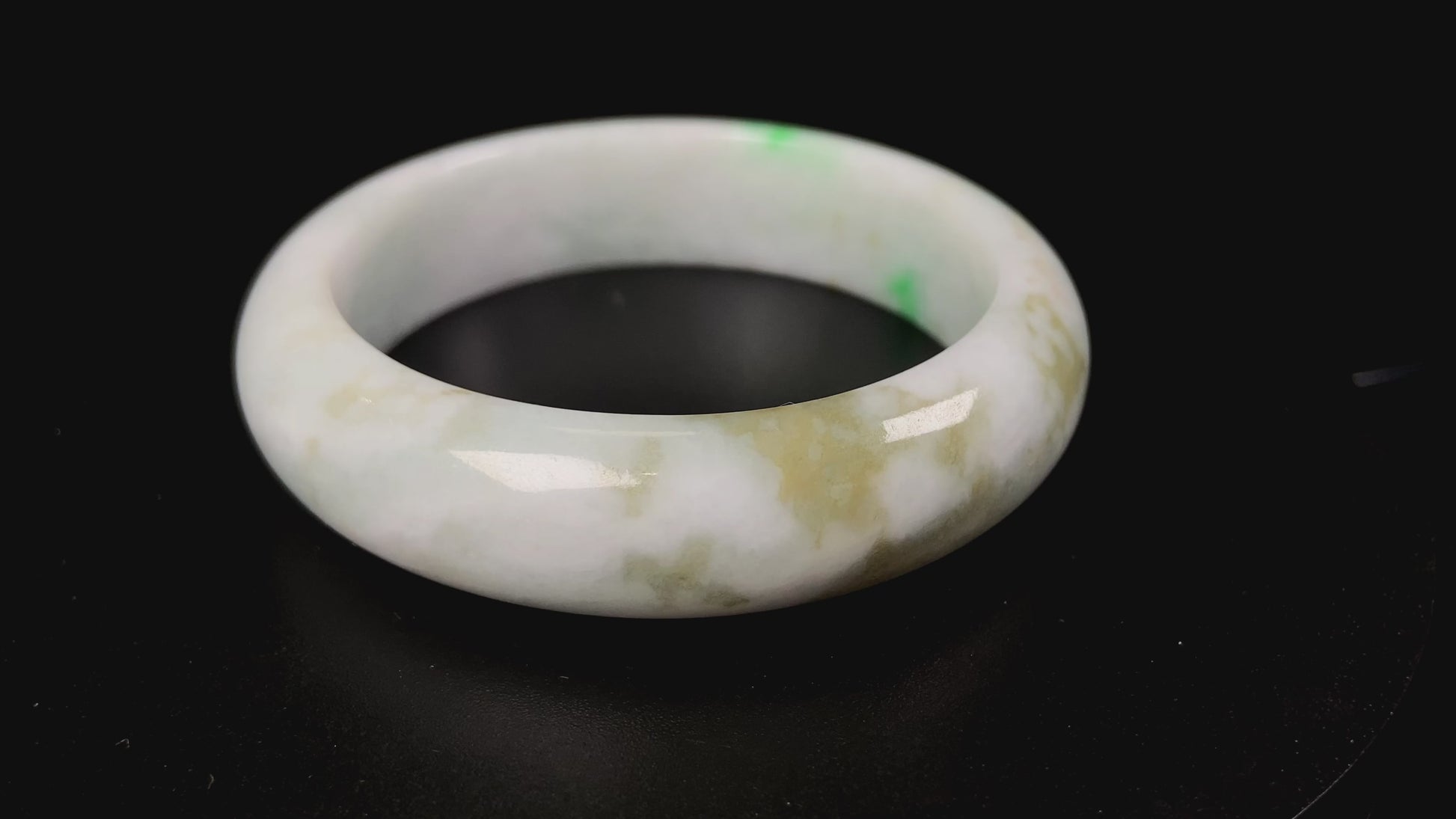 A green sprout jadeite bangle.