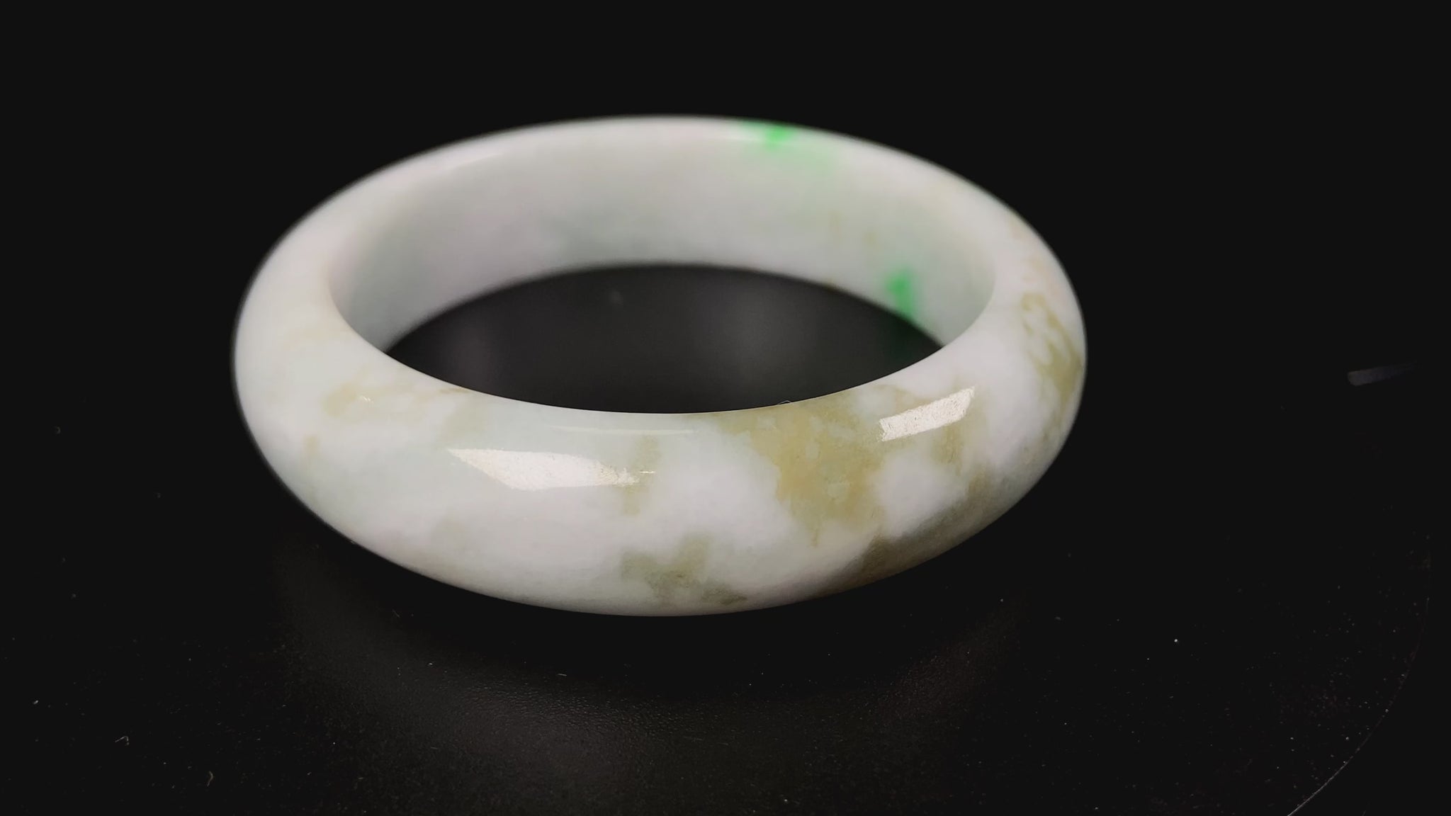 A green sprout jadeite bangle.