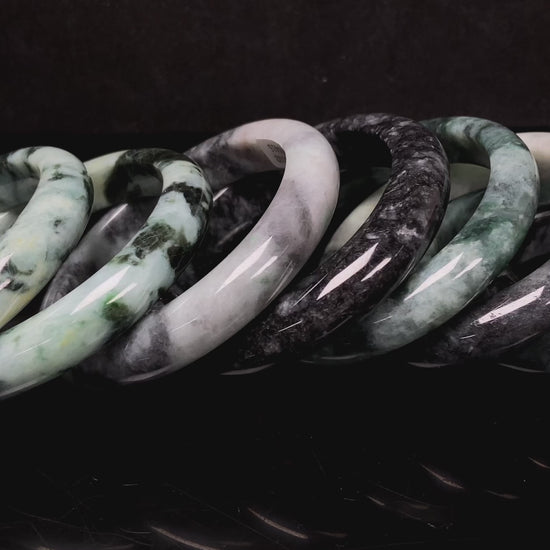 A white black jadeite bangle group.