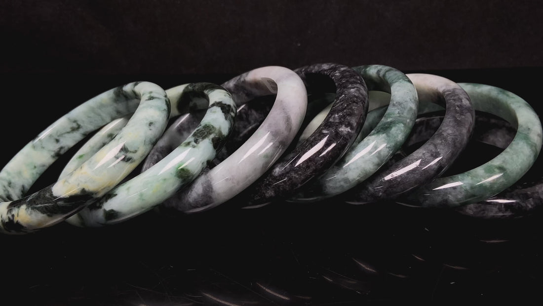 A white black jadeite bangle group.