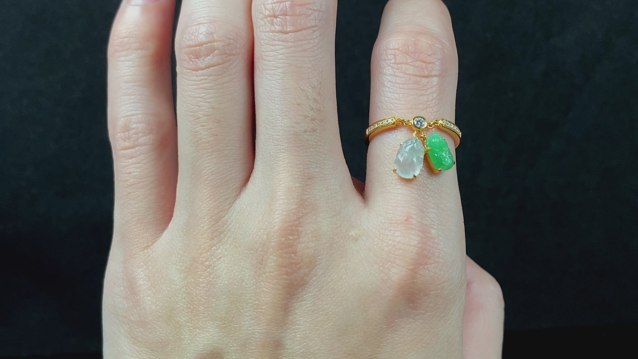 A icy white green dangling twin Pixiu jadeite ring.