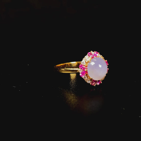 A round lavender pink accent jadeite ring.