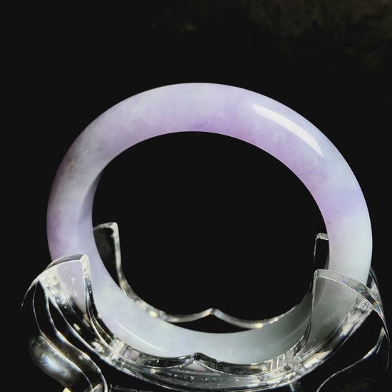 A split lavender green jadeite bangle.
