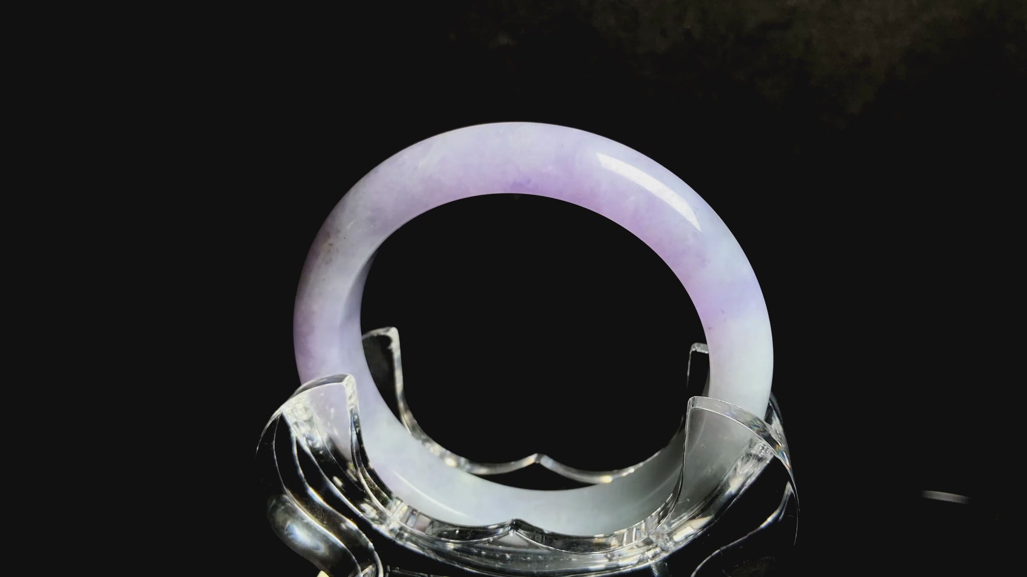 A split lavender green jadeite bangle.
