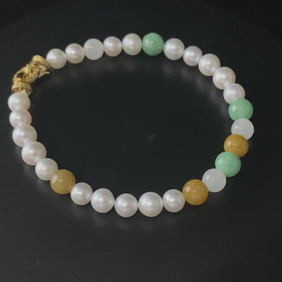 A sunlit mint pearl jadeite beads bracelet.