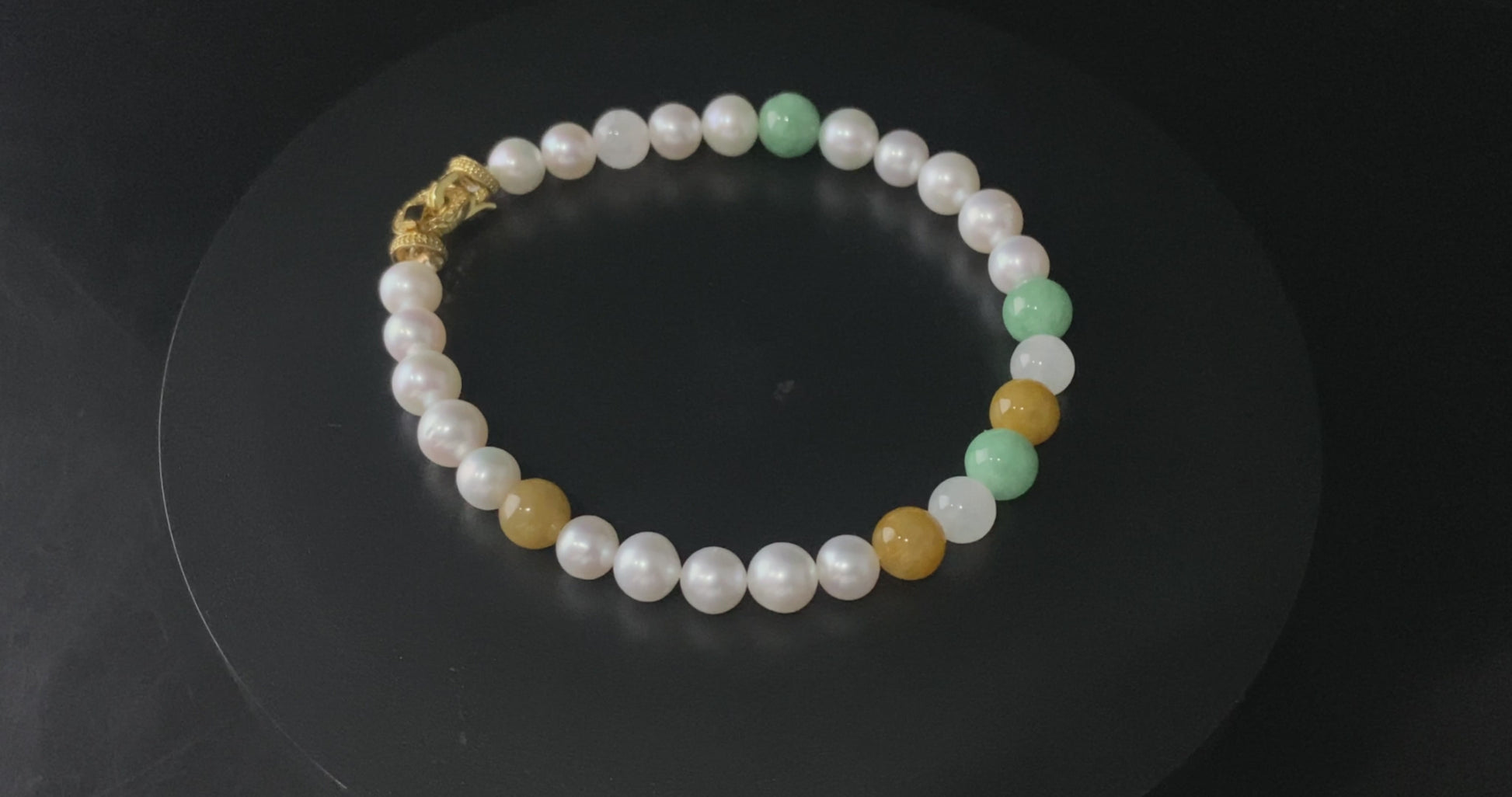 A sunlit mint pearl jadeite beads bracelet.