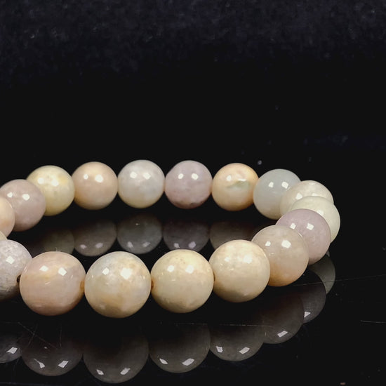 A warm beige serenity jadeite beads bracelet.