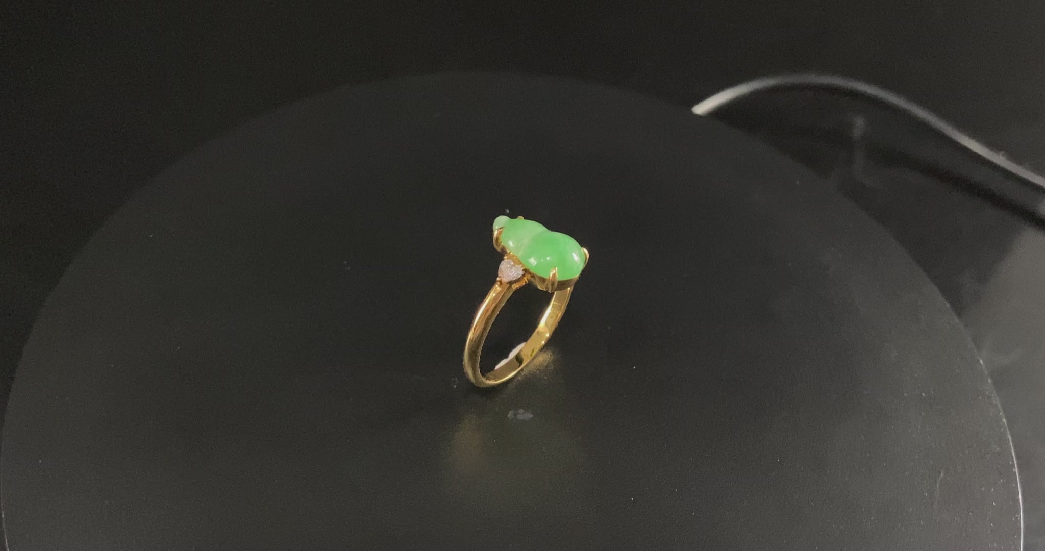 A prosperity gourd jadeite ring.