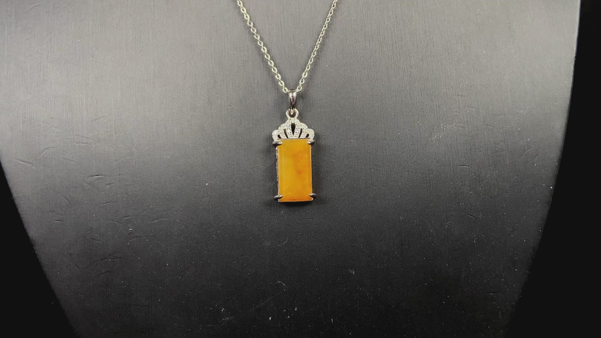 A amber glow of royal crown jadeite pendant.