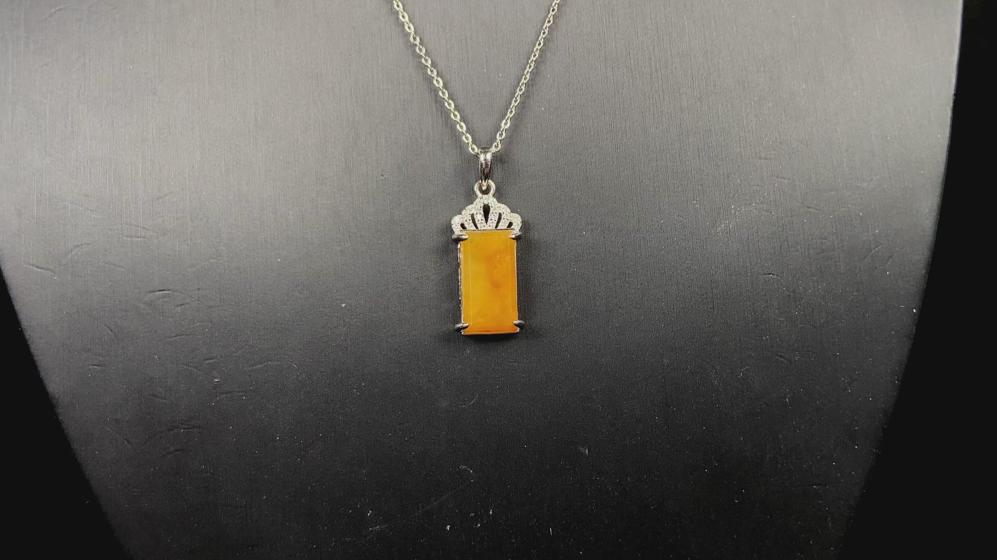 A amber glow of royal crown jadeite pendant.