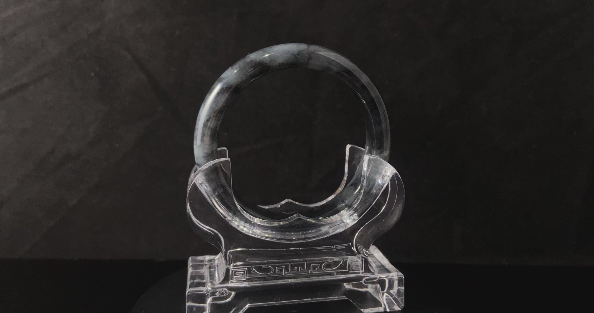 A grey cloud veil jadeite bangle.