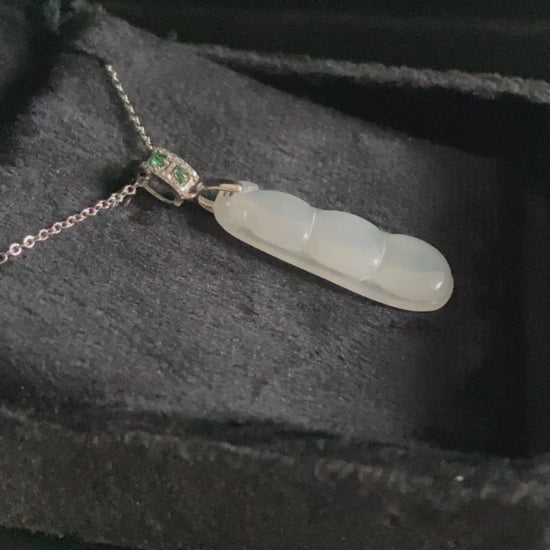 A glacial green bean jadeite pendant.