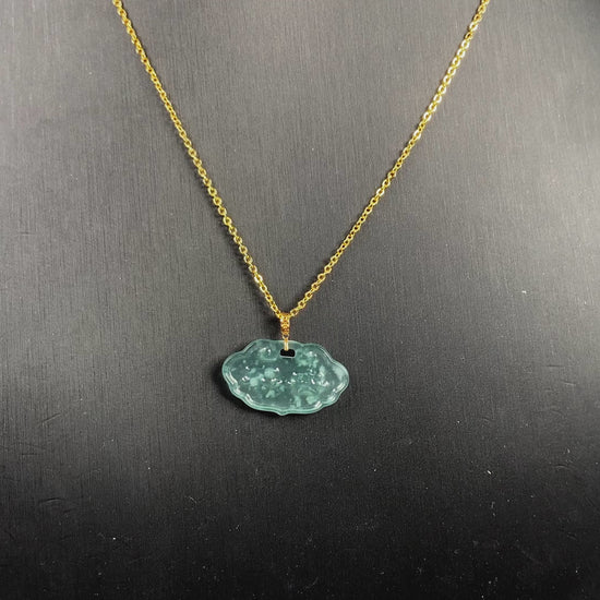 A floating flower icy blue jadeite pendant.