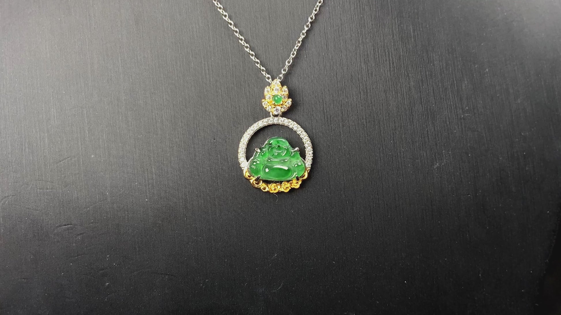 A lotus dual gold buddha jadeite pendant.