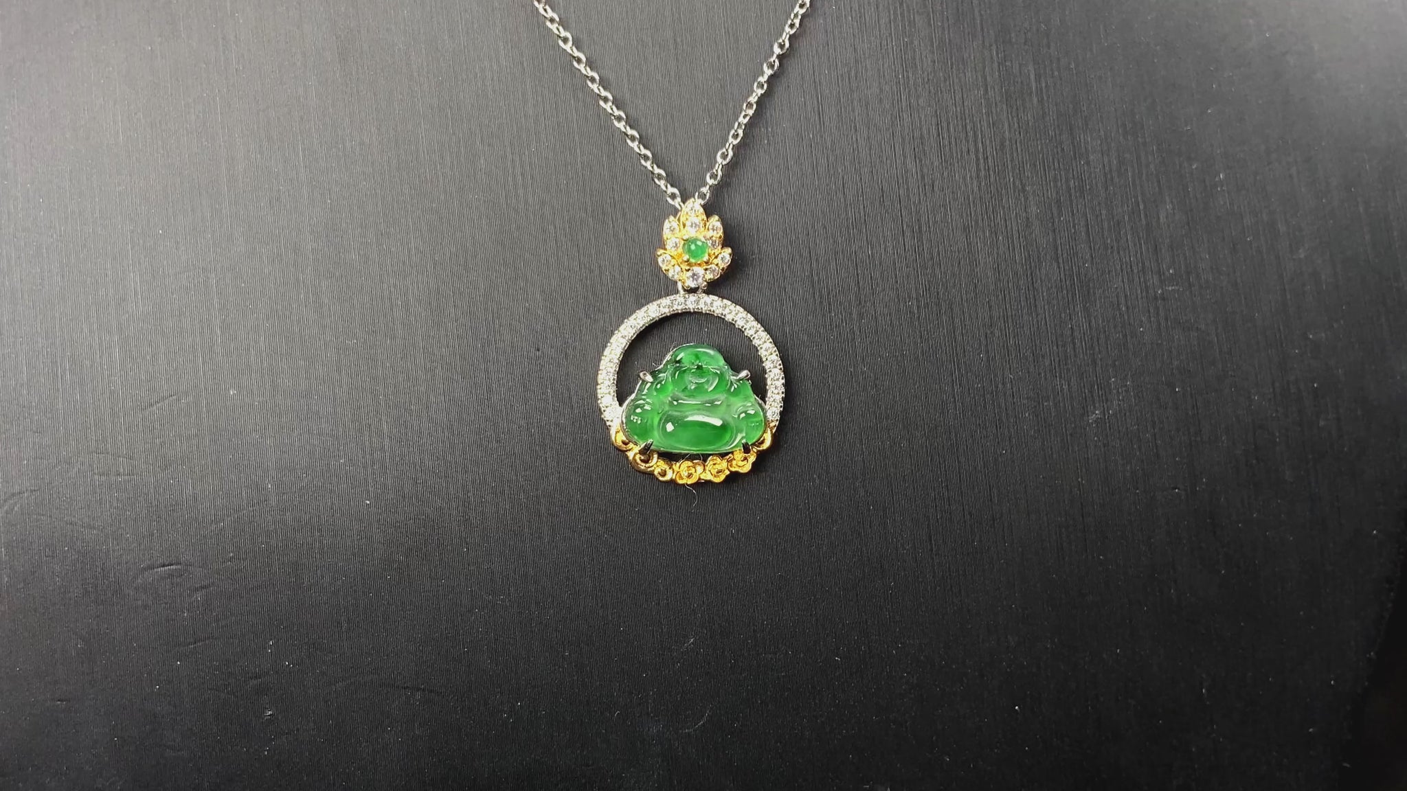 A lotus dual gold buddha jadeite pendant.