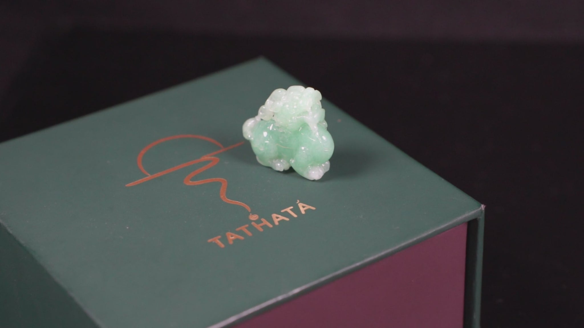 A luminous mint green Pixiu loose jadeite.