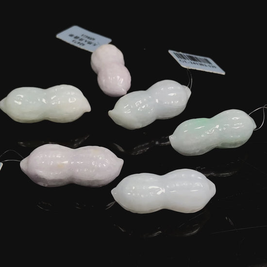  Luminous milky white peanut loose jadeite.