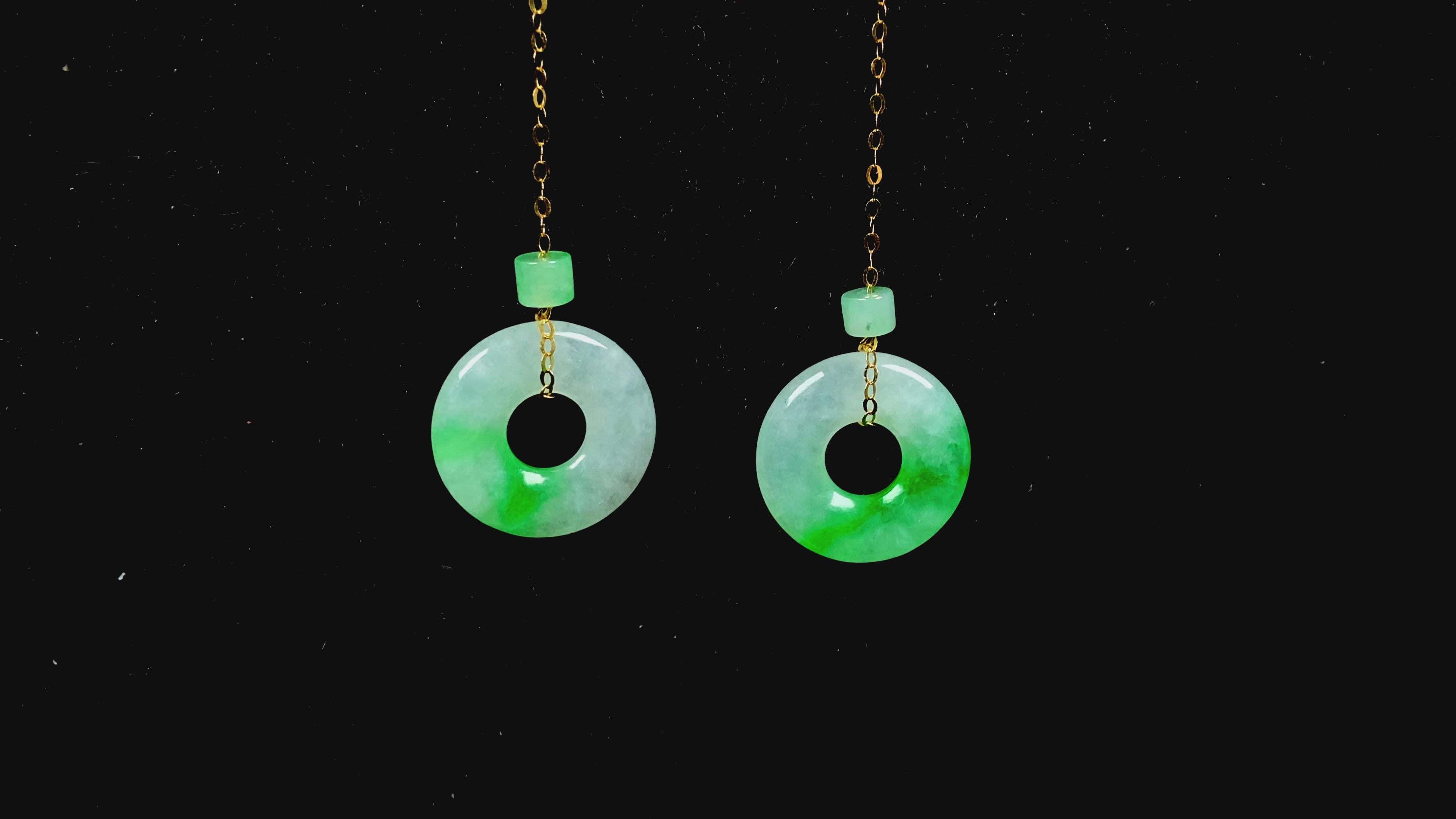 Load video: A milky white green cloud donut jadeite earring.