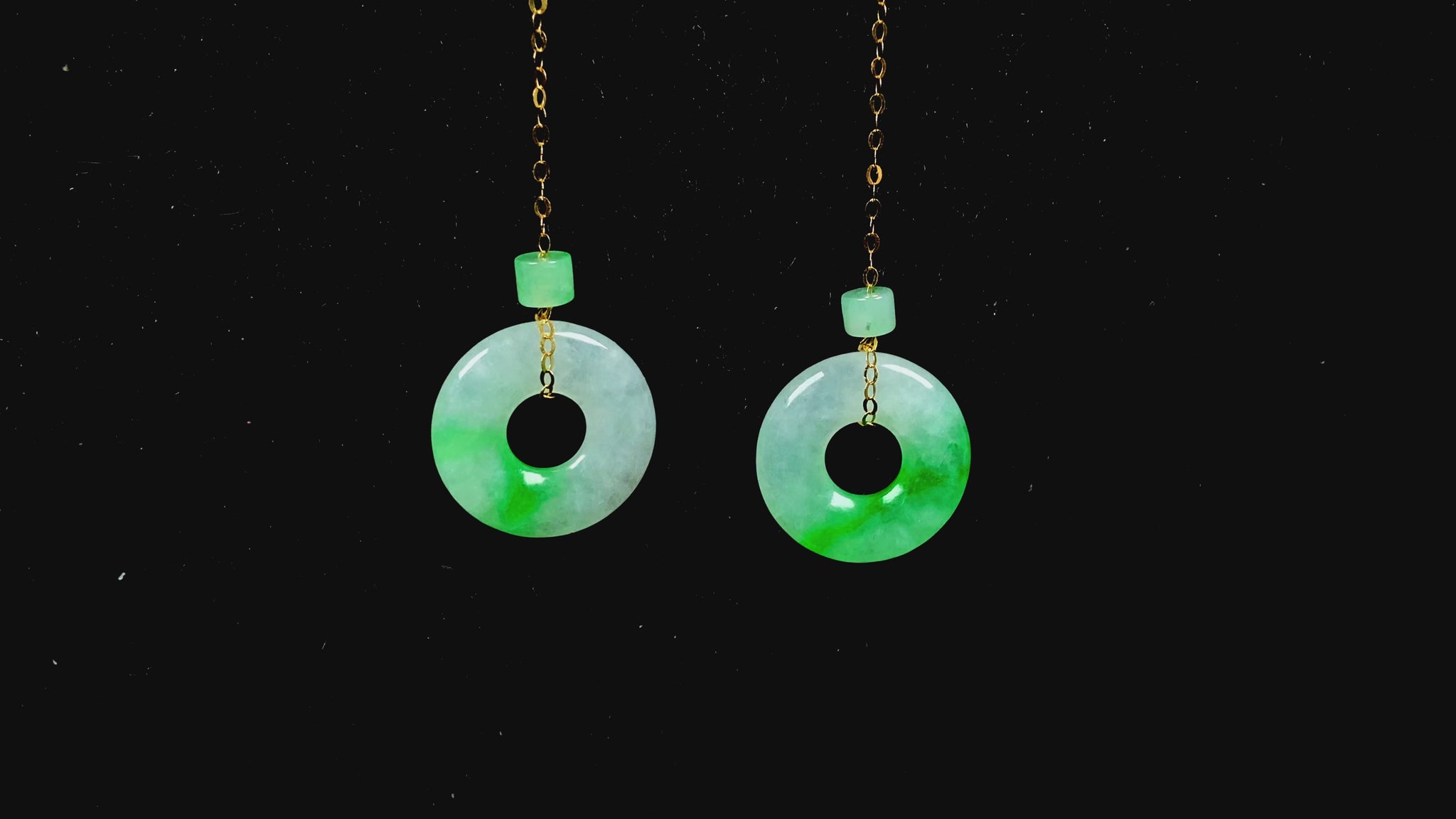 A milky white green cloud donut jadeite earring.