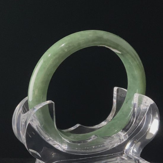 A grass green veil jadeite bangle.