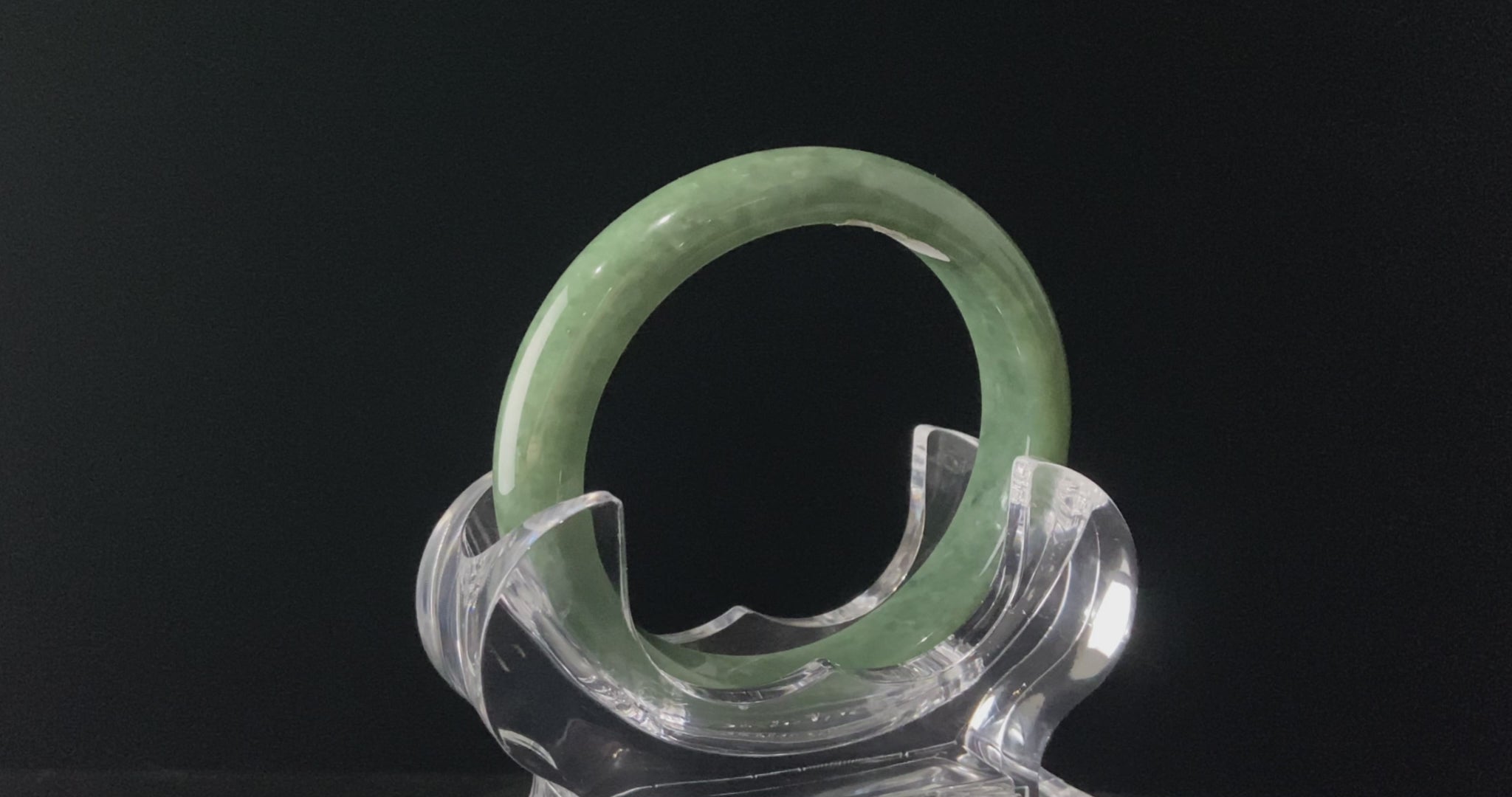 A grass green veil jadeite bangle.