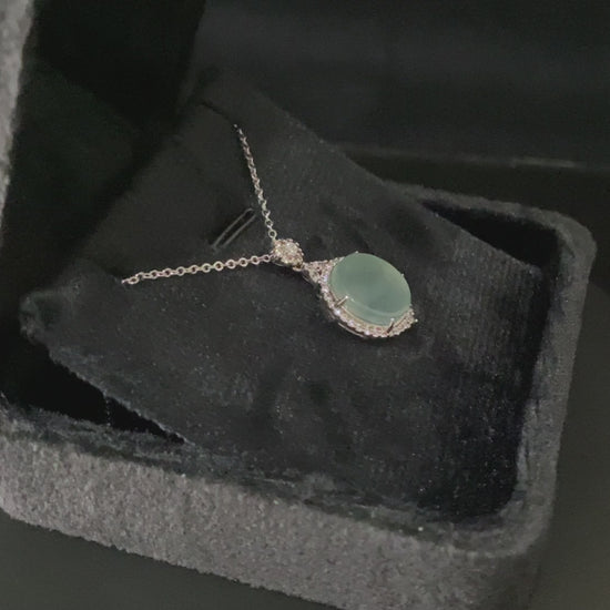 A mint dew disk jadeite pendant.