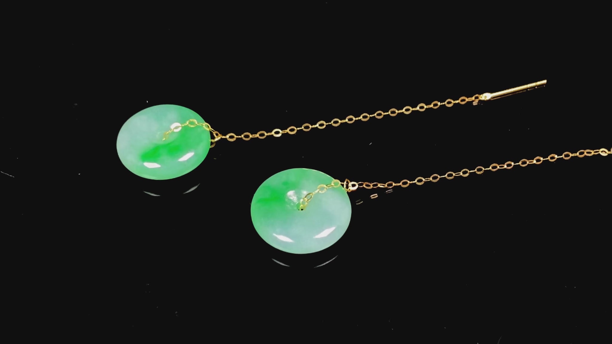 A peaceful green Ping An Kou jadeite earring.
