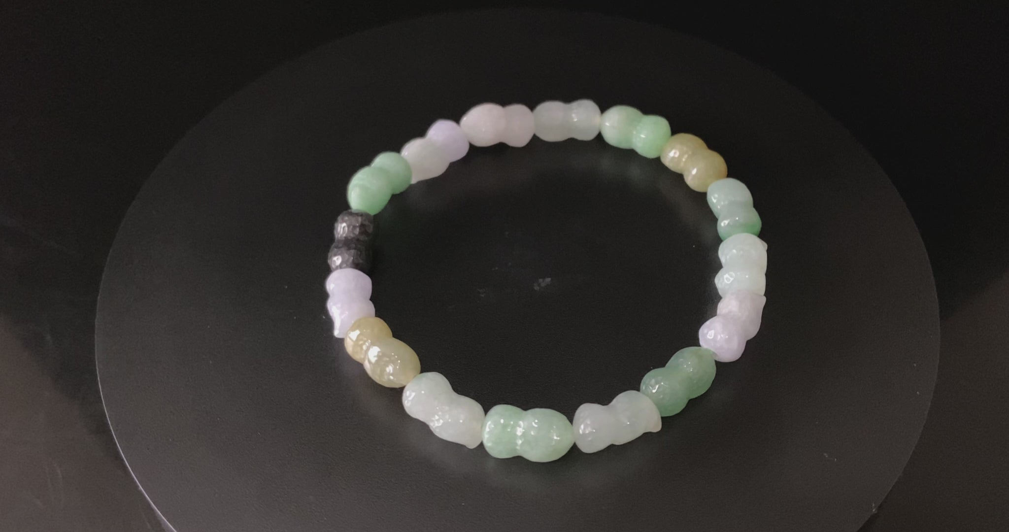 A multi color peanut jadeite beads bracelet.