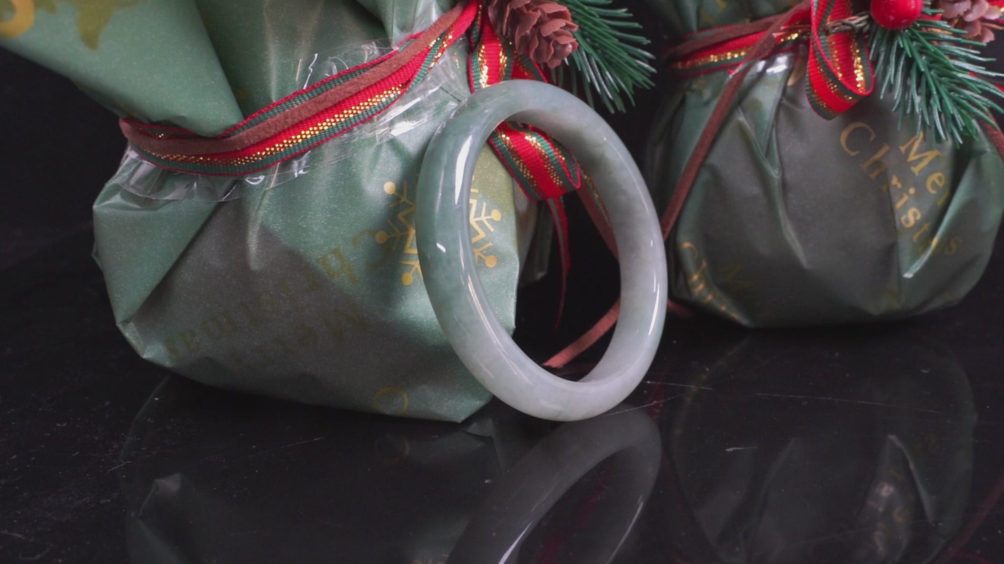 A mist green gentle luster jadeite bangle.