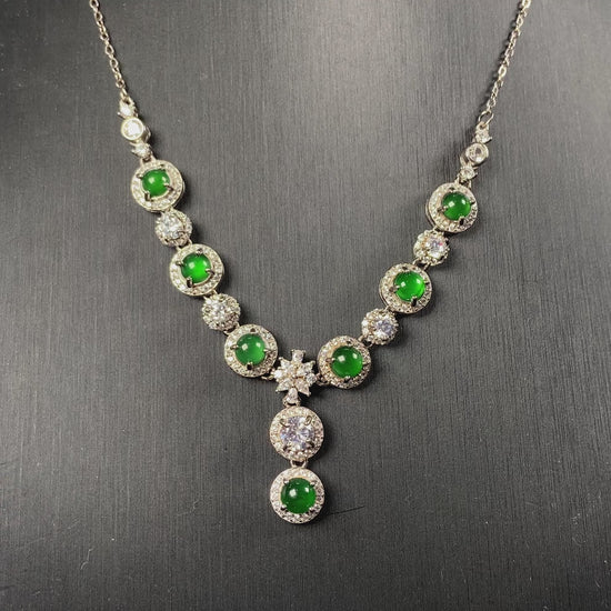 A vibrant green sparkle jadeite pendant.