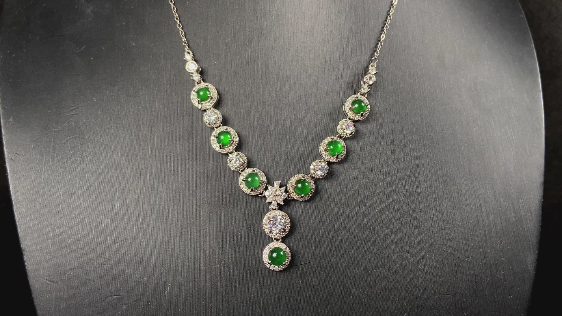 A vibrant green sparkle jadeite pendant.