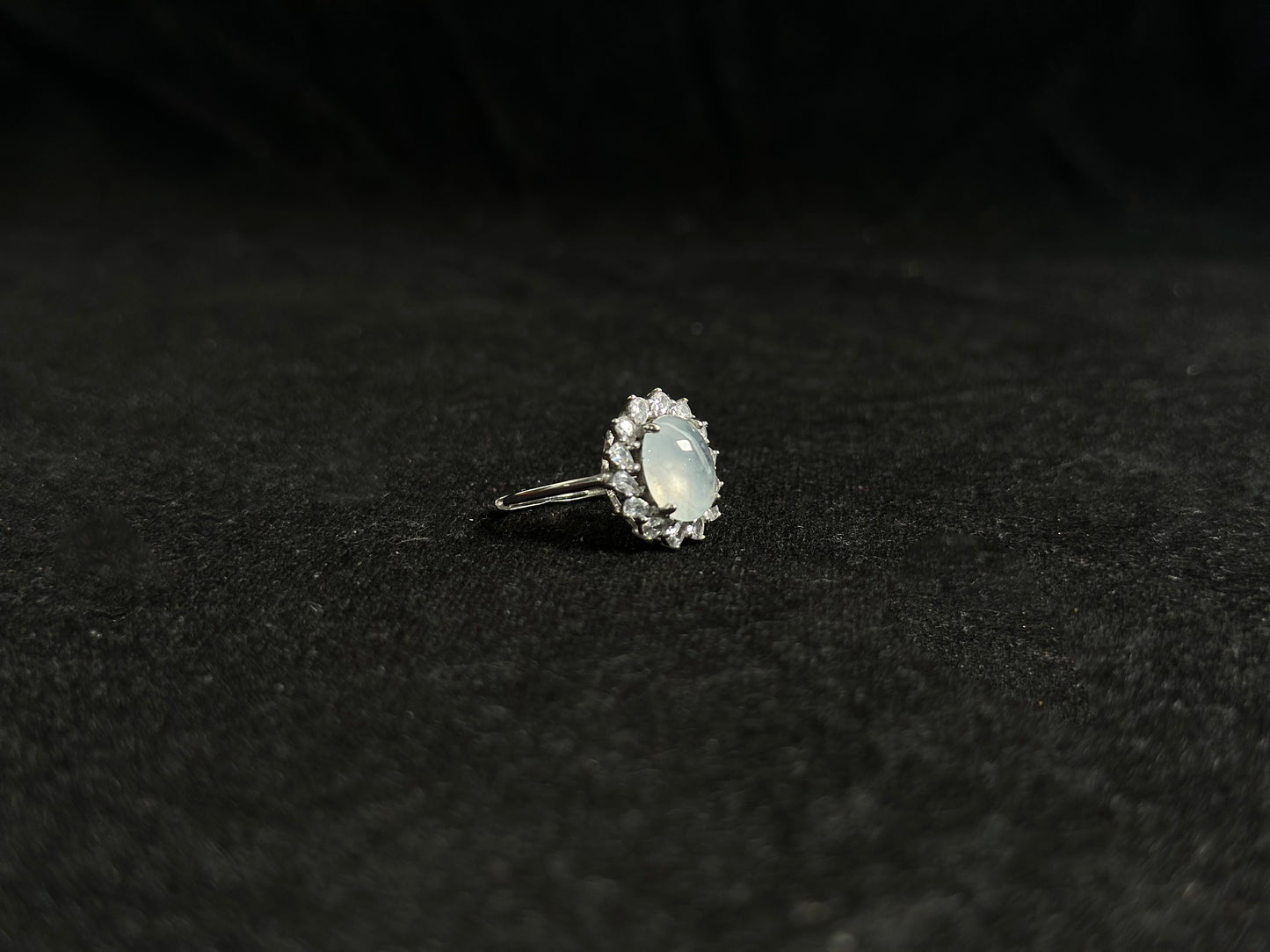 An icy jadeite bead is securely set in this ring using channel setting technique.