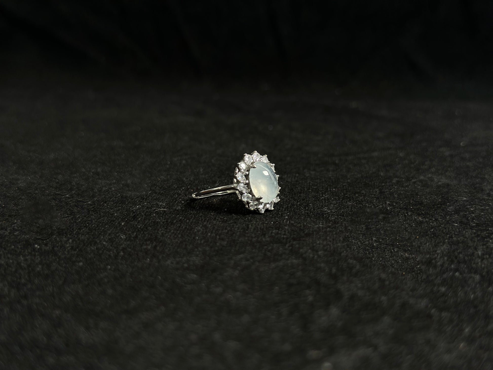 An icy jadeite bead is securely set in this ring using channel setting technique.