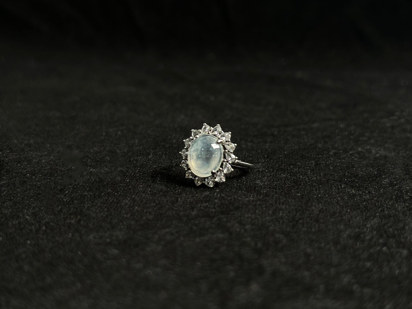 An icy jadeite bead is securely set in this ring using channel setting technique.