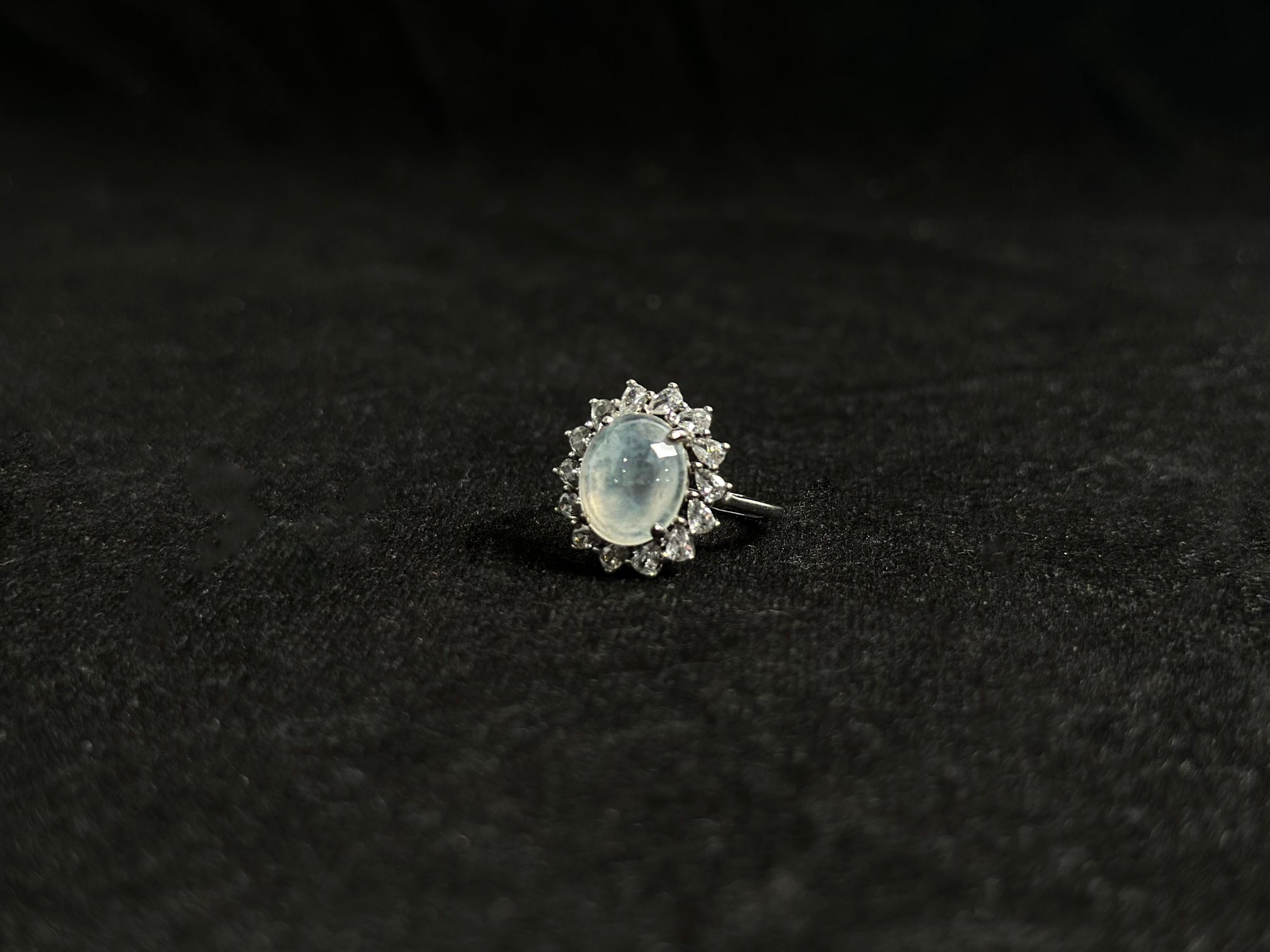 An icy jadeite bead is securely set in this ring using channel setting technique.