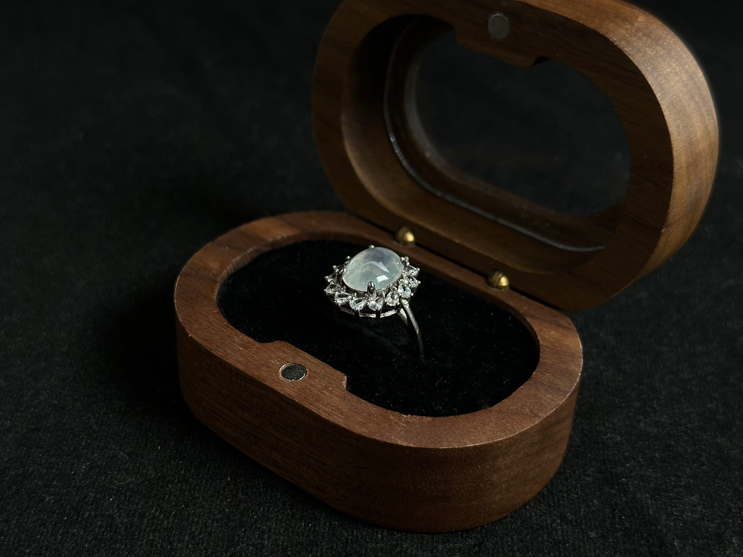 An icy jadeite bead is securely set in this ring using channel setting technique.