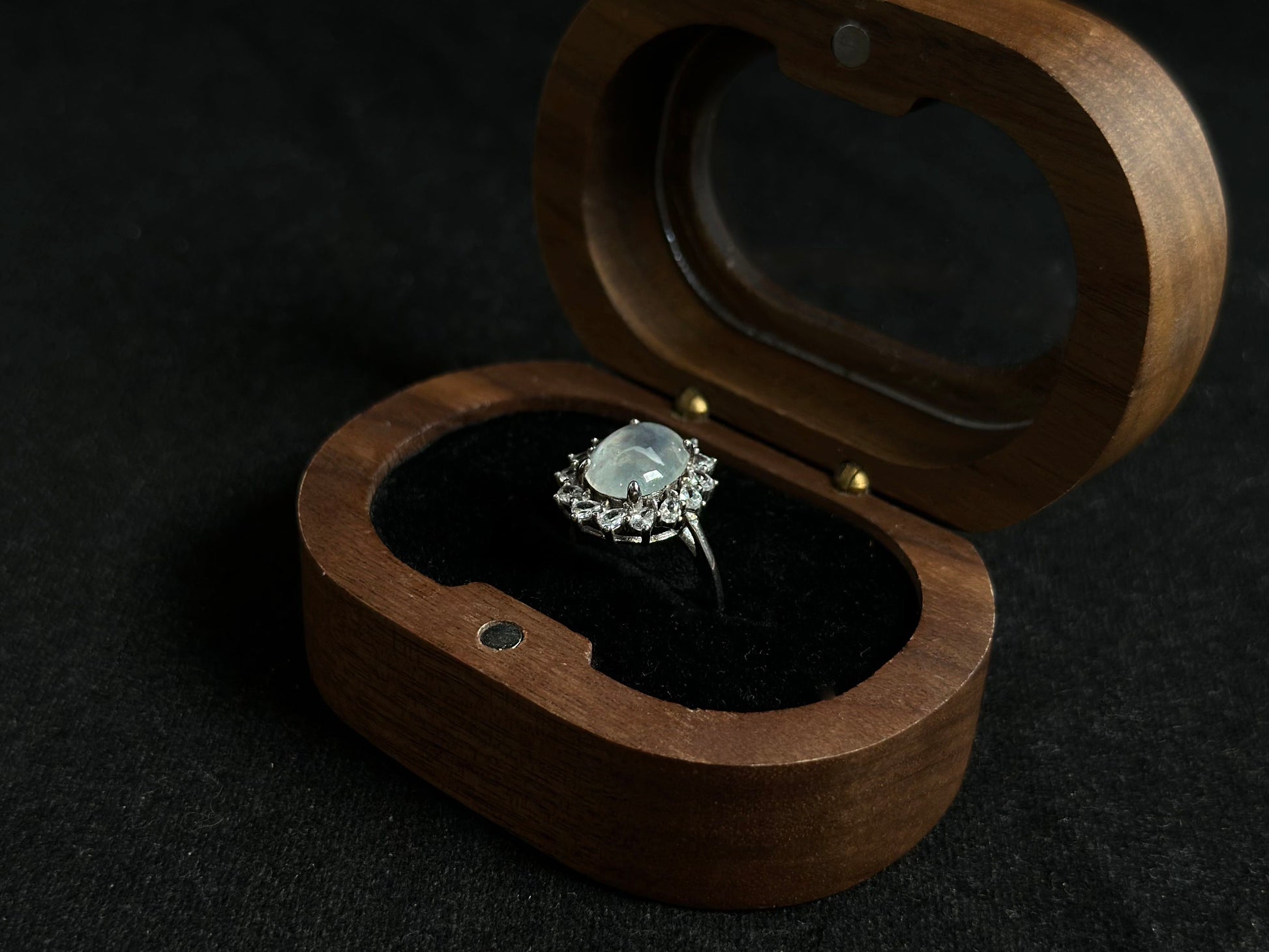 An icy jadeite bead is securely set in this ring using channel setting technique.