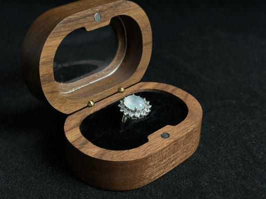 An icy jadeite bead is securely set in this ring using channel setting technique.