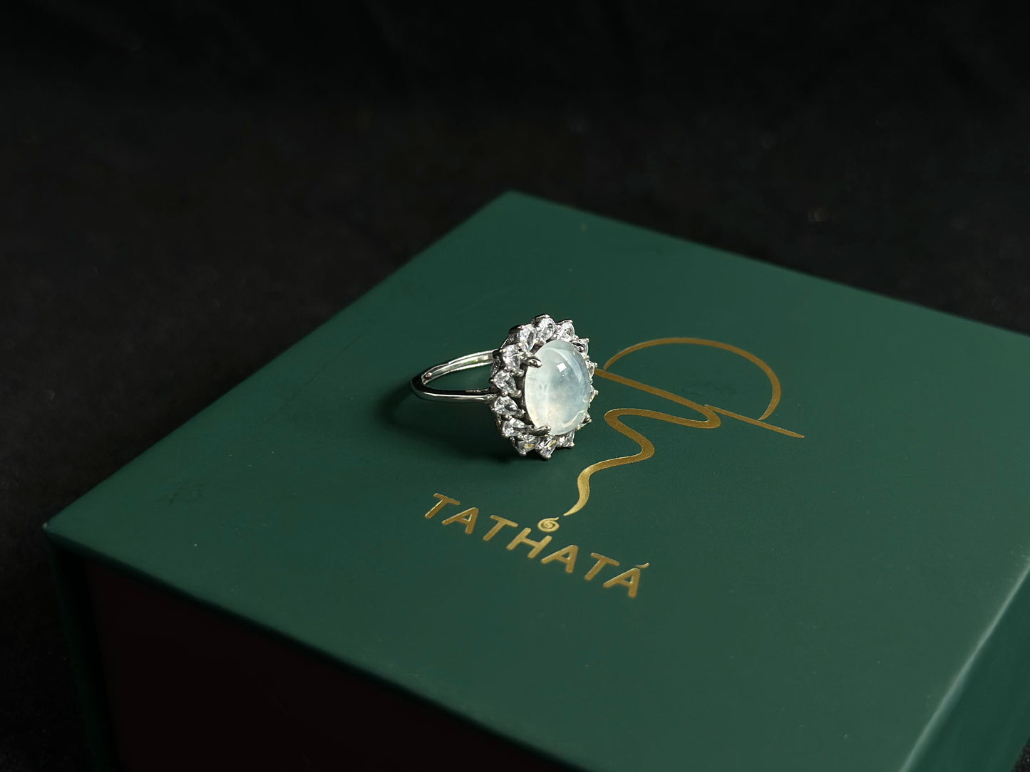 An icy jadeite bead is securely set in this ring using channel setting technique.